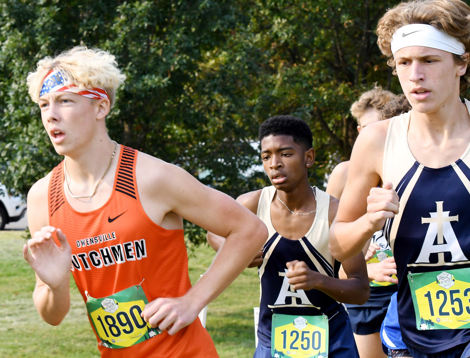 Jacob Breedlove (far left) leads a pack of runners during the varsity boys race at Forest Park in St. Louis back on Saturday, Sept. 11.
